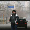 Chinese man walking in smog