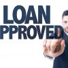 Business man pointing the text: Loan Approved